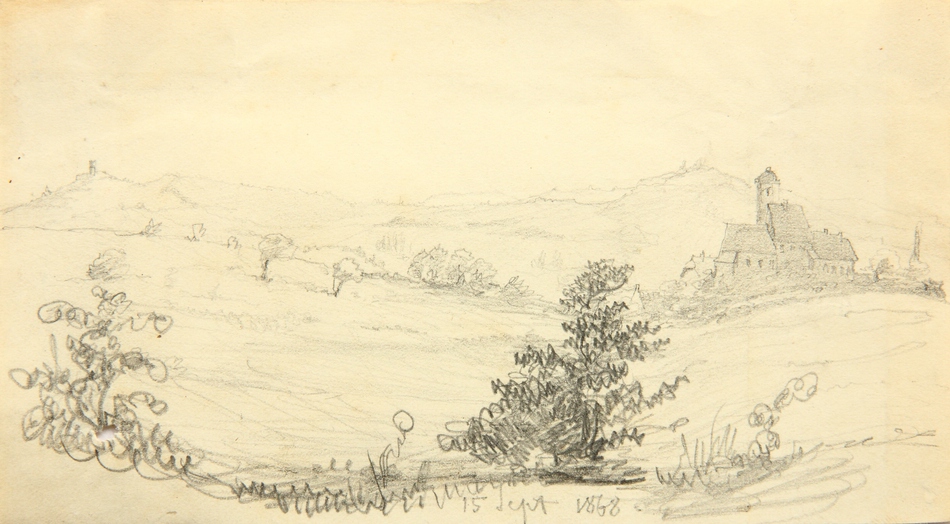 Hügellandschaft mit kleiner Stadt