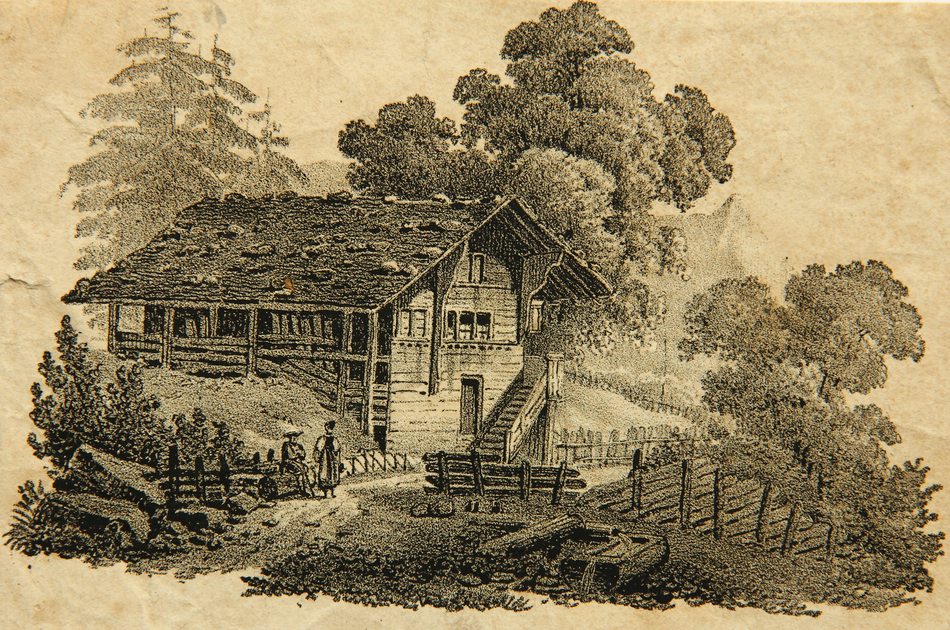 Tiroler Haus und Paar in Tracht