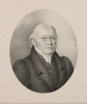 Herr in Anzug und Mantel