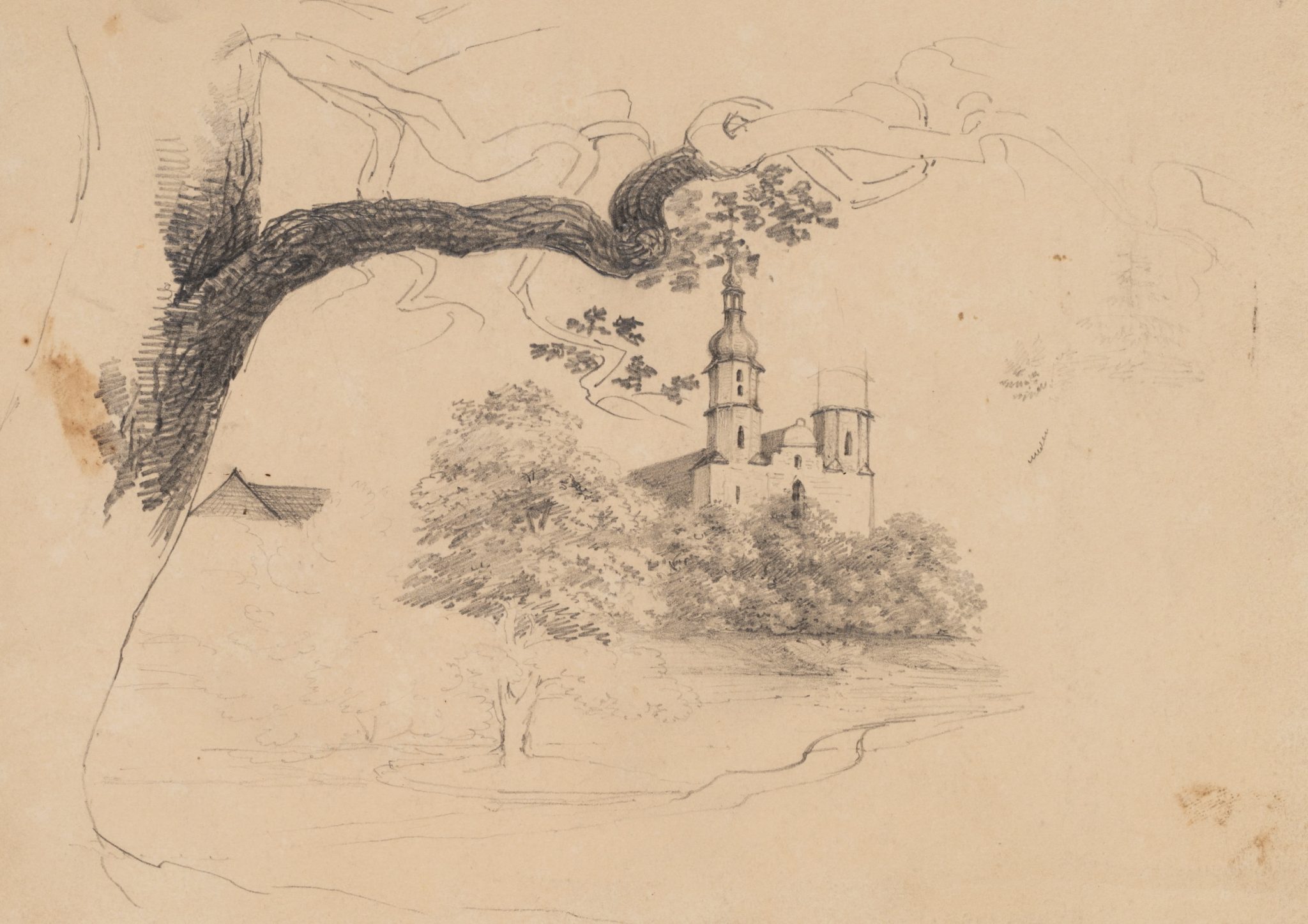 Baum im Vordergrund mit Kirche im Hintergrund