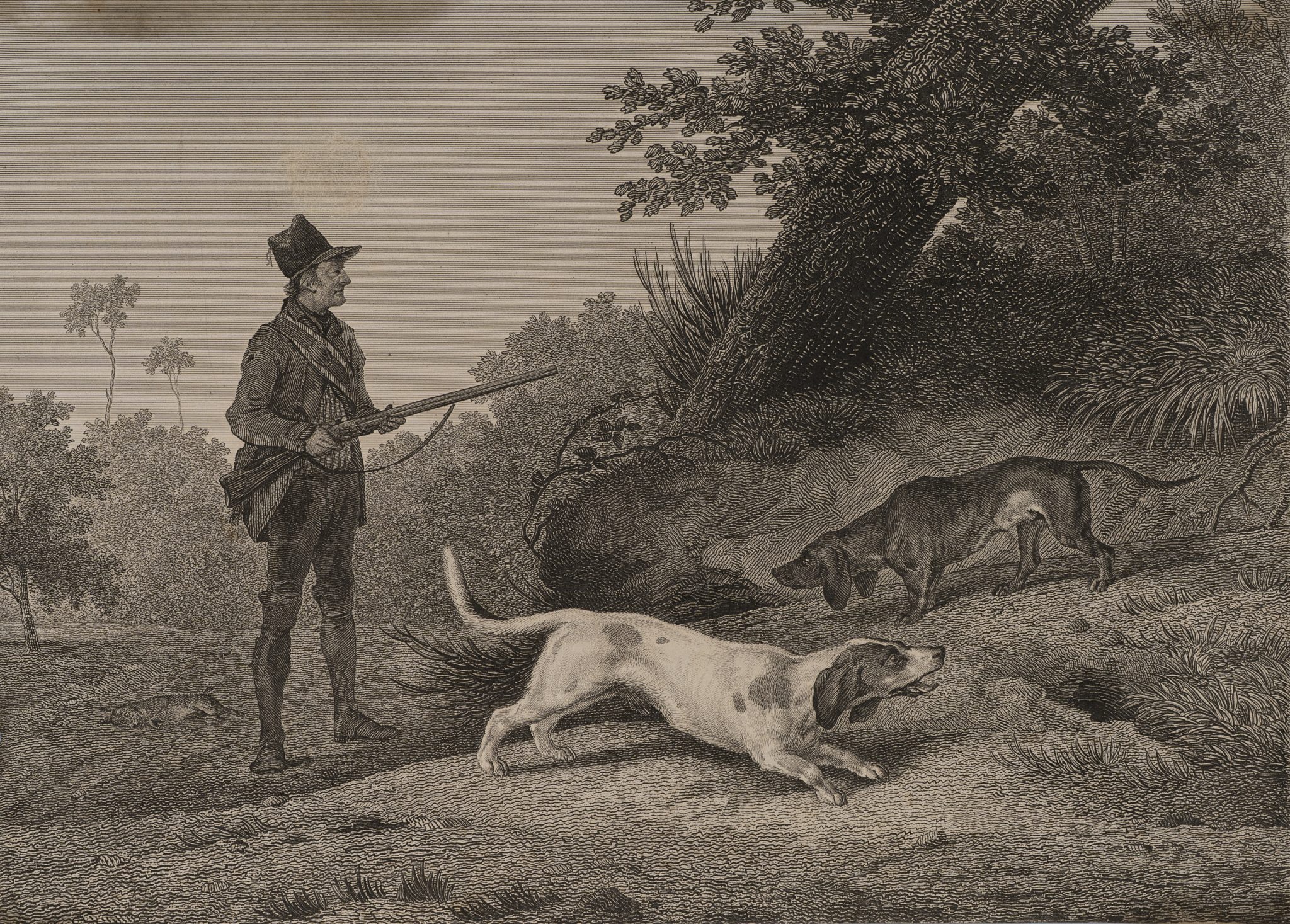 Jäger mit Hunden im Wald