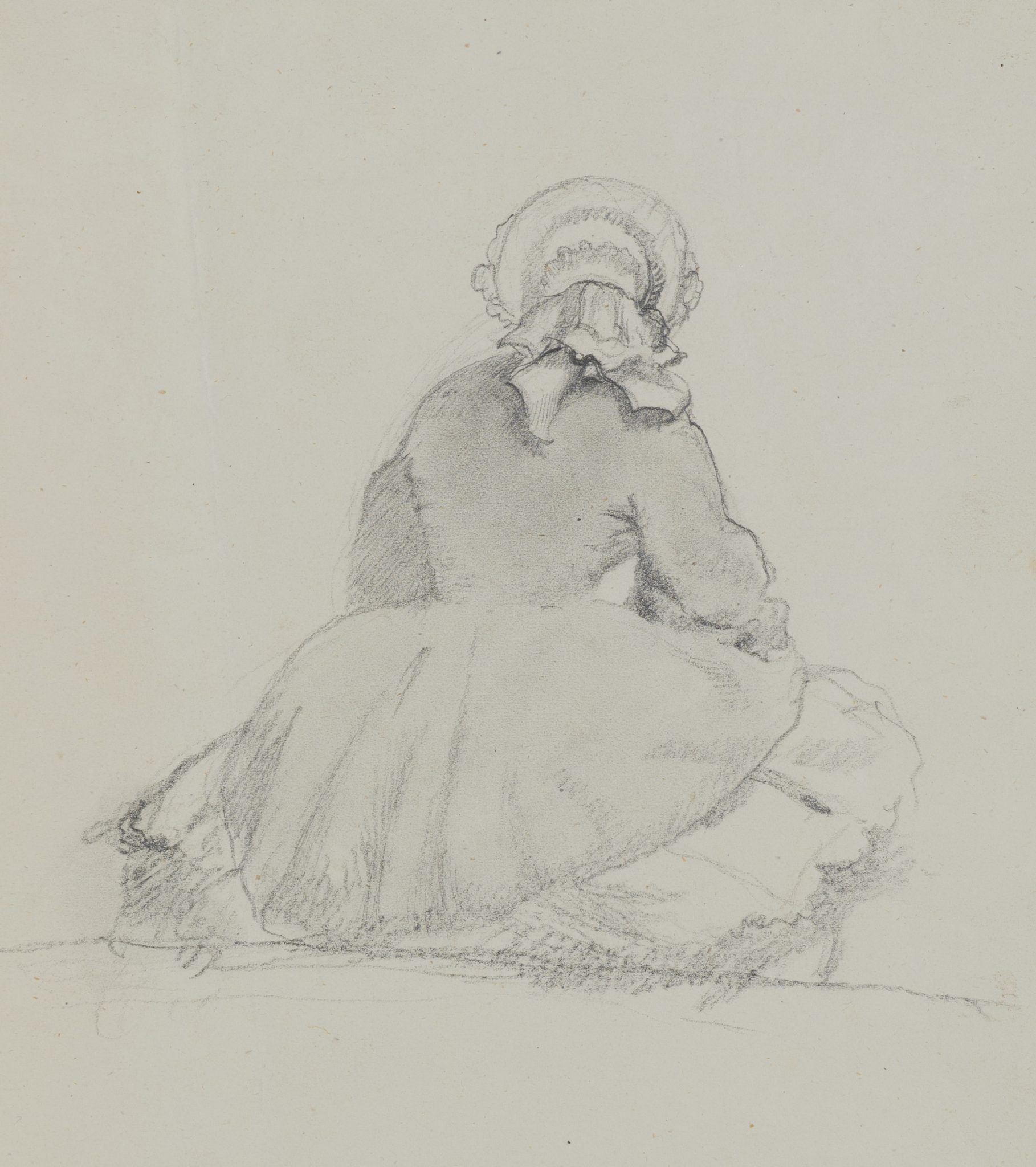 Sitzende Frau von hinten